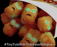 a pile of oranges with green eyes and words on them that say, tiny tots with their eyes all glow