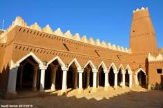 an old building with many arches and pillars