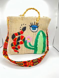 The perfect unique gift for that special person Handmade of henequen and beautifully embellished by artisans in Mexico these bags are a must have for the summer or any occasion . We have different syle of color bags which you can choose. Small bag dimensions  Material: Henequen. Height: 9.5 inches Width: 12 inches Depth: 5 inches Strap 120cm Medium bag dimensions Material: Henequen. Height: 12 inches Width: 14 inches Depth: 5 inches Strap 120cm embroidered straps to be used as shoulder or crossbody. variation on color of staps and bag. Chic Multicolor Embroidered Bag, Multicolor Embroidered Vacation Bag, Luxury Embroidered Multicolor Bags, Luxury Bohemian Bag With Multicolor Embroidery, Luxury Bohemian Multicolor Embroidery Shoulder Bag, Embroidered Bag, Special Person, Medium Bags, Small Bag