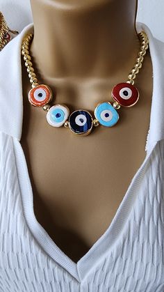 5 murano evil eye ball bead necklace  8 mm ball bead necklace with 5 different color gold plated  murano evil eye necklace. 17 inch long plus 2 inch chain total 19 inch long . Gold Evil Eye Bracelet With Round Beads, Metal Beaded Necklaces With Large Beads As Gift, Metal Necklace With Large Beads For Gift, Evil Eye Metal Jewelry For Gifts, Colorful Beads Metal Jewelry For Gift, Metal Evil Eye Jewelry For Gift, Evil Eye Metal Jewelry Gift, Multicolor Round Evil Eye Jewelry, Colorful Beads Metal Jewelry Gift