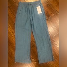 Athleta New Linen Pants. Hard To Find Blue. Size 4. Nwt. Sporty Wide Leg Denim Pants, Sporty Straight Leg Denim Pants, Sporty Mid-rise Jeans, Sporty Relaxed Fit Denim Pants, Sporty Denim Pants With Relaxed Fit, Casual Mid-rise Activewear With Pockets, Spring Sports Pants With Pockets, Sporty Stretch Denim Bottoms, Sporty Stretch Jeans For Spring