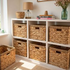 some baskets are sitting on top of a shelf