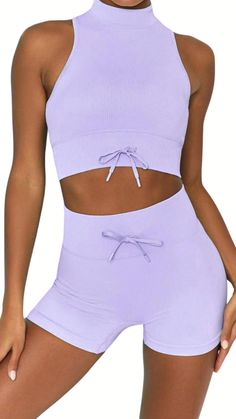 Brighten your workouts with this High neck sports bra and yoga shorts set with a bow detail, activewear set.  The purple workout set gives you coverage in the bust area and is perfect for working out or just as a top to run errands.  Feel the heat on our Lavender high waist shorts, they're stretchy quick-drying, breathable fabric, and versatile on every occasion. OH! And you can be sure you'll look good in it. Materials: *75% nylon  *25% spandex Product Features and Benefits: *The Lavender High- Purple Workout Set, Lounge Wear Set, Fitness Wear Women, High Neck Sports Bra, Sports Bra Set, High Neck Bra, Activewear For Women, Sports Wear Women, Women's Sportswear