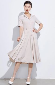 "This swing dress is a 50s inspired shirtwaist dress , featuring classic open neck, notched collar, and center front button closure, finished with a swing skirt, and handy side seam pockets. DETAILS * More colors available (Fabric No. 3) https://etsy.me/2SAGHSM * 50% linen ,50% cotton * Two seam pockets * Front Button up closure * Short sleeve * Notched collar * Pleated dress * Below knee Length * Perfect for Spring, Summer * Wash by hand or machine with cold water * The model is 170cm (5′7″) ta Vintage A-line Dress With Buttons, Classic A-line Vintage Dress With Buttons, Classic A-line Vintage Dress With Button Closure, Casual Collared Dress With Pleated Waist, Fitted A-line Shirt Dress With Buttons, Chic Short Sleeve Vintage Fashion Dress, Vintage Chic Short Sleeve Dress, Chic Short Sleeve Vintage Dress, Chic Vintage Fashion Dress With Short Sleeves