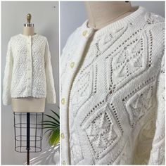 "1960's Diamond Knit Pointelle Cardigan Sweater * open weave pointelle knit with diamond pattern * ribbed crewneck * ribbed, scalloped hem and cuffs * creamy ivory pearlescent buttons Label-Wintuk Circa-60s Material-100% orlon acrylic Condition-excellent like new condition women's size-XS-S. depending on desired fit.  shown on a size XS dress form 33-25-35 Shoulders 16\" Bust 38\" Sleeve length (shoulder to cuff) 22\" length (top of shoulder to hem) 23\" Measurements: All measurements are taken with the garment laying flat, doubled for the bust, waist and hips make. Please sure you leave yourself a little wiggle room for a comfortable fit! *all items are vintage and pre-loved.  All major flaws are noted but may include slight imperfections as part of their past life.  blemishes like loose Pointelle Cardigan, Pointelle Knit, Knit Stitches, Open Weave, Scalloped Hem, Dress Form, Past Life, Vintage 60s, Jumpers And Cardigans