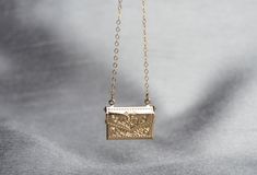 "This beautiful and personalized locket necklace would be a perfect Valentine's gift for any loved one! The gold plated letter locket charm measures approximately 21x16mm (including jump ring) and is hung on a 16\", 18\" or 20\" gold plated or 14k gold filled chain. The locket opens and you can add a tiny photo or sweet note inside. The chains are dainty and very pretty - the perfect delicate necklace for everyday wear. This sentimental gift is sure to be the recipient's favorite piece of jewelr Gold Locket Necklace For Mother's Day Personalized Gift, Yellow Gold Locket Necklace With Charms For Gift, Gold Locket Necklace With Hallmark For Mother's Day, Gold Locket Necklace For Mother's Day With Hallmark, Gold Locket Necklace For Mother's Day, Gold Charms Locket Necklace Keepsake, Personalized Brass Locket Necklace For Gift, Gold Locket Jewelry Perfect For Gifting, Gold Locket Jewelry Gift