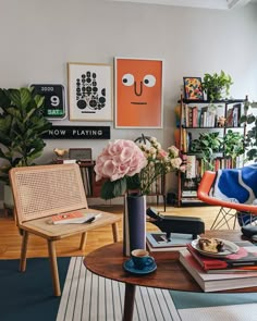 a living room filled with furniture and flowers