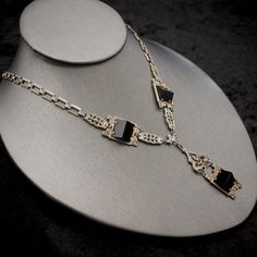 "Fine Antique Art Deco 925 Sterling Silver + Onyx + Marcasite Lavalier Pyramid Necklace- Authentic Jewelry of the 1920s Measurements: Chain: 18.5\" + 2 1/8\" (lavalier pendant) Display bust is not life size, so compare chain length (above) with a necklace in the personal collection of the recipient or yourself in order to be sure how the piece will lay on the wearer. Excellent antique condition, no missing stones. Reference photos provided for you to verify condition. Disclaimer on multiple purc Art Deco Jewelry For Vintage Events, Art Deco White Gold Necklace With Gemstone, Art Deco White Gold Gemstone Necklace, Formal Onyx Necklace With Polished Finish, White Gold Art Deco Gemstone Necklace, Classic Onyx Necklaces For Formal Occasions, Formal Onyx Necklace With Black Enamel, Art Deco Evening Gemstone Jewelry, Victorian Evening Necklace With Hallmark