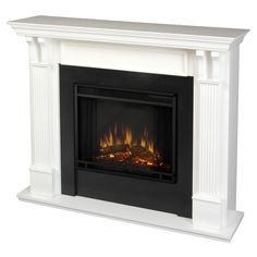 a white fireplace with flames in it