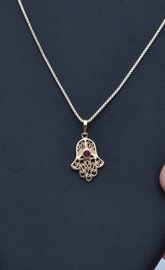 Hamsa Necklace Lucky Hamsa Necklace Gold Hamsa Necklace Inlaid Red Gemstone Fine Ruby Stone Necklace Fatima Hand Chain Spiritual Necklace Filigree Work Filigree Jewelry Gold Fatima Hand Jewelry Hamsa Jewelry Ruby stone jewelry Hamsa necklace made of high quality 21K gold filled A gift for a woman A gift for Valentine's Day A gift for an anniversary A gift for her A gift for a mother Red Gemstone Pendant Necklaces, Red Gemstone Pendant Necklace, Traditional Red Necklace With Round Pendant, Traditional Red Round Pendant Necklace, Red Birthstone Necklace For Weddings, Red Wedding Necklace With Birthstone, Red Jewelry With Adjustable Chain For Wedding, Traditional Red Round Pendant Jewelry, Red Wedding Jewelry With Adjustable Chain