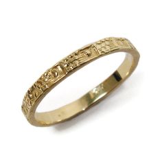 a gold ring with writing on it