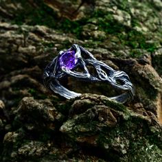 This sterling silver ring captures the essence of the woodland with its delicate branch design, creating a truly unique and ethereal piece of jewelry. The amethyst adds a touch of mystique, making it a perfect choice for those seeking a distinctive self-love promise ring. Crafted with care, this silver elven jewelry embodies the charm of the forest, making it an ideal accessory for those with a penchant for cottagecore aesthetics. Characteristics: Metal - Recycled solid sterling silver  Stone - Cubic Zirconia Finish - Oxidized. View all silver nature engagement rings: https://www.etsy.com/shop/TinyShinyJewel?ref=seller-platform-mcnav&section_id=45470754 Care instructions: To care for the ring, avoid contact with water and chemicals such as perfumes and lotions. When the ring is not in use, Magical Sterling Silver Jewelry For Promise, Sterling Silver Fantasy Style Promise Ring, Magical Gemstone Promise Ring, Mystical Gemstone Promise Ring, Silver Mystical Crystal Birthstone Ring, Silver Crystal Birthstone Ring, Mystical Sterling Silver Promise Ring, Magical Silver Crystal Promise Ring, Silver Magical Crystal Promise Ring