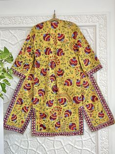 Uzbek hand embroidery suzani robe, chapan, coat. * Measurements: length - 125 cm, chest round - 120 cm, hips round - 120 cm, sleeve - 48 cm, sleeves round - 44 cm * Coat with ikat inside lining "Suzani" means needlework, but to most collectors, the word has a more specific meaning: "suzani" is synonymous with the glorious embroideries of Uzbekistan, in Central Asia. In recent years, we've witnessed a remarkable revival of this old traditional art form. These textiles are pretty complex, which indicates their importance. In fact, suzanis were part of a bride's dowry, generally started at the birth of a daughter and continued with the help of family and friends until the bride's dowry was complete and ready to be presented to the groom at the wedding. It was a symbol of the family's status, Traditional Kurta With Multicolor Floral Embroidery, Traditional Multicolor Embroidered Kurta With Floral Print, Traditional Kurta With Multicolor Embroidery And Floral Print, Traditional Printed Motifs Kaftan Tunic, Traditional Tunic Kaftan With Printed Motifs, Festive Long Sleeve Kaftan With Printed Motifs, Festive Long Sleeve Printed Kaftan, Traditional Sets With Floral Print And Kimono Sleeves, Kurta With Printed Motifs And Kimono Sleeves