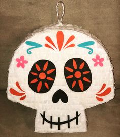 a paper plate shaped like a sugar skull