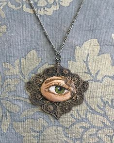 LOVER'S EYE Jewelry, Pendant - original painting by Tina Tarnoff, vintage pendant Bohemian Hand-painted Enamel Jewelry, Hand Painted Bohemian Enamel Jewelry, Bohemian Hand Painted Enamel Jewelry, Artistic Enamel Necklace For Collectors, Handmade Antique Enamel Necklaces, Vintage Hand Painted Round Pendant Necklace, Bohemian Hand Painted Jewelry For Art Collection, Vintage Enamel Jewelry With Filigree Details, Vintage Hand-painted Pendant Necklace