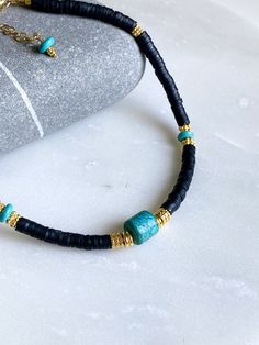 FILIPPA NECKLACE Black Fimo choker necklace with turquoise central stone, turquoise beads, fimo beads and gold plated details Dimensions: Total necklace length  38cm/ 14,9in + 5cm / 1,9in extra extender chain Weight: 22gr DELIVERY (estimate delays) Greece: 2-5 business days via ELTA  Europe: 5-10 business days via Hellenic Post International: 10-21 business days via Hellenic Post You can shorten considerably your delivery times by upgrading to DHL Express services at checkout.  All PURE GREEK Jewels  are inspired from the ancient greek arts, folklore traditions and world cultures. Our jewelry are handmade with love and imagination so you can enjoy unique creations.   I use mineral and semi-precious stones, crystals, real pearls,  gold plated brass metal, wooden elements, greek and oriental Beach Jewelry With Black Heishi Beads, Adjustable Bohemian Turquoise Necklace With Heishi Beads, Turquoise Jewelry With Black Beads For Festival, Adjustable Turquoise Heishi Bead Necklaces, Handmade Adjustable Black Turquoise Necklace, Adjustable Turquoise Jewelry With Black Beads, Turquoise Jewelry With Black Beads, Handmade Turquoise Heishi Beads Necklace, Adjustable Turquoise Heishi Beads Necklace