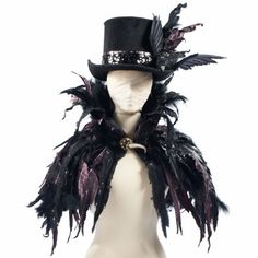 a male mannequin wearing a black top hat and feathered coat with feathers on it