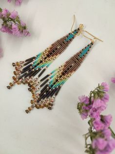 Bohemian Long Drop Beaded Earrings With Dangling Beads, Bohemian Long Drop Chandelier Earrings With Dangling Beads, Festival Brown Beaded Earrings With Tassels, Bohemian Tassel Earrings With Beaded Fringe, Handmade Bohemian Long Drop Chandelier Earrings, Bohemian Beaded Long Drop Earrings, Bohemian Chandelier Earrings With Fringe And Round Beads, Bohemian Beaded Fringe Earrings, Bohemian Brown Beaded Earrings With Dangling Beads