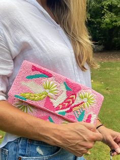 A hand sewn double sided beaded and embroidered clutch purse in pink with multi-colored embroidered flowers. Each clutch is unique and has individual characteristics. The silver chain strap can be worn as a crossbody or over the shoulder or as a clutch without a strap. This is a beautiful and unique clutch you will love! Rose Vibe, Pink Vibe, Embroidered Clutch Purse, Unique Clutch, Clutch Pink, Summertime Outfits, Embroidered Clutch, Pink Vibes, Beaded Clutch