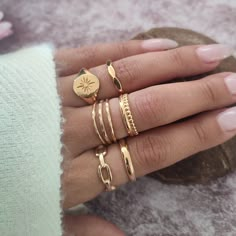 A variety of Gold Adjustable Rings, Sold individually. Stylish, handmade, and finely detailed rings that will fit perfectly in all sizes between 6US - 9.5US Details ◾ Size - Adjustable between sizes US6 - US9.5 ◾ Material - High-quality thick coat of gold plating over brass ◾ Hypoallergenic, Lead/Cadmium/Nickel Free ◾ Handmade and finely detailed ring, made with high-quality material Ring Dimensions; ◾ Ring A Width - Up to 4mm/Thickness - 2mm ◾ Ring B Width - 5mm/Thickness - 2mm ◾ Ring C Up to 4 Lots Of Gold Rings, Gold Layered Rings, Adjustable Rings Gold, Gold Rings Trendy, Gold Rings Layered, Trendy Gold Rings For Women, Gold Rings Cute, Women’s Gold Jewelry, Gold Rings Styling