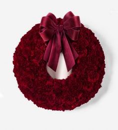 a red wreath with a bow tied around it