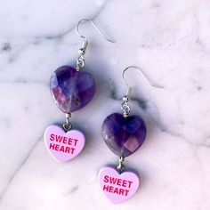 Gemstones are genuine amethyst metal is stainless steel earring wires are hypoallergenic Purple Metal Earrings For Gift, Nickel-free Dangle Earrings For Valentine's Day, Purple Metal Earrings As Gift, Metal Heart Dangle Earrings For Gift, Purple Metal Crystal Earrings For Gift, Purple Metal Crystal Earrings As Gift, Purple Crystal Metal Earrings For Gifts, Nickel-free Dangle Jewelry For Valentine's Day, Purple Dangle Metal Jewelry