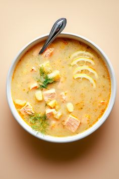 a bowl of soup with meat and potatoes