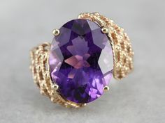 A deep eggplant purple amethyst glitters with light and flash at the center of this asymmetrical, Mod style cocktail ring! Light and airy for all of its substantial size, this vintage piece is sure to make an impression! Metal: 10K Yellow Gold Gem: Amethyst 7.33 Carats Gem Measurements: 15.8 x 11.7 mm, Oval Ring Size: 6.75 Marks: "10K" Stamped on the inside band Beautiful Vintage Rings, Ladies Jewellery, Beautiful Rings Vintage, Gold Gemstone Ring, Mod Style, Eggplant Purple, Oval Ring, Oval Rings, Amethyst Jewelry