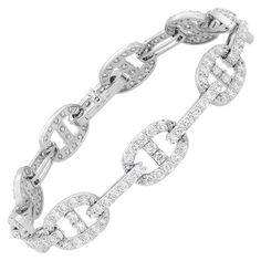 Introducing our exquisite 4.90 Carat Diamond Chain Link Bracelet in 18K White Gold. This bracelet is a true testament to luxury and sophistication. Featuring oval links encrusted with a magnificent 4.90 carats of diamond pave, it radiates brilliance and captivates attention. The chain link construction not only adds an elegant touch but also ensures extreme comfort, allowing the bracelet to drape effortlessly on your arm. Whether you want to make a bold statement or prefer a more subtle look, th Modern Bracelets, American Modern, Diamond Chain, Look Plus, Chain Link Bracelet, Modern Jewelry, Bracelet Necklace, Pave Diamonds, Diamond White