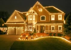 a large house with christmas lights on it