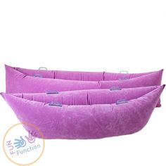 three purple pillows sitting on top of each other