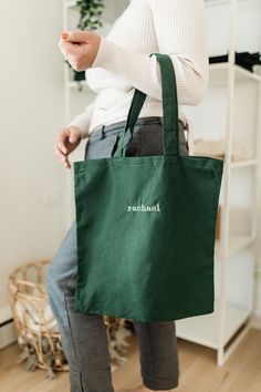 Our Essential custom name embroidered tote bag is made to order and personalized with your name on it! This tote bag is the perfect size to carry all of your daily essentials, making it perfect as a casual everyday bag or a reusable grocery tote. Perfect for yourself, mom, bridesmaids, teachers, Christmas or Bday gift! DETAILS - 100% cotton - Natural (15 1/2 in x 16 in) - Black (16 1/2 in x17 1/2 in) - Machine Embroidered HOW TO ORDER 1) From the dropdown menu, choose your tote bag color 2) In t Customizable Green Bags For Personalized Gifts, Green Bag With Embroidered Logo For Everyday Use, Personalized Green Bags For Daily Use, Green Cotton Bags With Embroidery, Everyday Green Embroidered Bag, Embroidered Green Cotton Bags, Green Embroidered Cotton Bags, Customizable Green Bags For Daily Use, Eco-friendly Embroidered Bags As Gifts