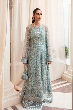 Classic Aqua Blue Embroidered Pakistani Wedding Dress Gown Shirt is a work of art featuring a chic embellished net that Evokes a sense of magnificence. Blue Embroidered Dress For Wedding, Blue Embroidered Dress For Wedding With Intricate Embroidery, Blue Embroidered Wedding Dress With Intricate Details, Blue Embroidered Wedding Dress With Intricate Embroidery, Blue Wedding Dress With Intricate Embroidery, Blue Floor-length Embroidered Dress For Wedding, Elegant Gown With Intricate Embroidery For Eid, Elegant Embroidered Organza Gown, Luxury Wedding Dress With Resham Embroidery