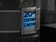 a sign that reads 20th century limited on the side of a train in black and white