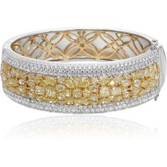 Behold the artistry of the Two Tone Diamond Cluster Bangle from the renowned house of Roman & Jules, a masterpiece that marries the timeless allure of 18K white and yellow gold with the mesmerizing brilliance of diamonds. This exquisite bangle is a symphony of contrasting hues and scintillating gemstones.At its heart lies a captivating cluster of light yellow diamonds, an awe-inspiring ensemble that boasts a total carat weight of 13.50 carats. These radiant gemstones exude warmth and elegance, m Luxury Brilliant Cut Cuff Bracelet For Wedding, Luxury Wedding Cuff Bracelet With Brilliant Cut, Luxury White Gold Cuff Bracelet For Wedding, Luxury Hallmarked Gold Bracelet For Wedding, Luxury White Bangle For Anniversary, Luxury Hallmarked Diamond Bracelet For Wedding, Yellow Gold Wedding Bracelet With Pave Setting, Wedding Yellow Gold Bracelet With Pave Setting, White Gold Brilliant Cut Cuff Bracelet For Wedding