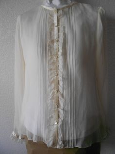 "Beautiful 100% sheer silk blouse Long sleeve Ruffled front and sleeves Expressive six front lines on both sides Satin accentuated along neckline, center and sleeve ends Great condition with no stains or rips Dimensions Shoulder 15\" Bust 39\" Sleeve 24\" Length 24\"" Classic Sheer Blouse For Work, Classic Sheer Top For Office, Sheer Long Sleeve Office Blouse, Sheer Long Sleeve Blouse For Work, Elegant Sheer Blouse For Party, Sheer Silk Office Blouse, Sheer Silk Long Sleeve Blouse, Classic Sheer Blouse For Office, Silk Long Sleeve Blouse For Layering