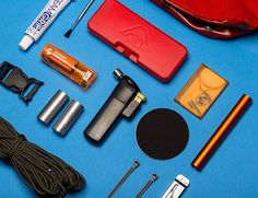 an assortment of items laid out on a blue surface