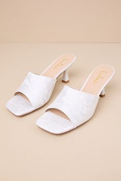 You'll be obsessed with the amount of compliments coming your way when you step out wearing the Lulus Maeler White Lace High Heel Slide Sandals! These ultra-romantic, lace-covered heels feature a trendy square footbed and an extra-wide vamp strap. A sculpted kitten heel completes the sleek slide-on design. 2. 5" sculpted heel. Lightly cushioned insole. Felted rubber sole has nonskid markings. Man made materials. Imported. Lulus | Maeler White Lace High Heel Slide Sandal Heels | Size 9. White Lace Party Sandals, Spring Lace Heels With Pointed Toe, Summer Wedding Shoes With Almond Toe, Summer Lace Heels With Block Heel, Closed Toe Heels For Summer Bridal Shower, Summer Lace Block Heel Heels, Low Heel Summer Wedding Guest Heels, Closed Toe Heels For Bridal Shower In Summer, Low Heel Heels For Wedding Guest In Summer