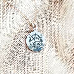 "Looking for a stylish accessory that you can wear every day ? Look no further than this gorgeous and dainty COMPASS necklace! Made of 925 sterling silver, this necklace features a sun compass pendant that's both elegant and practical. Engraved clearly and perfect to combine with other minimalist necklaces, this trendy pendant is also a great gift for any travel lover or globetrotter. Plus, it's also available as a bracelet, making it a versatile addition to your jewelry collection. ♡ DETAILS  P Sterling Silver Charm Necklaces As Gift For Her, Dainty Silver Engraved Charm Necklaces, Dainty Silver Engraved Charm Necklace, Sterling Silver Locket Charm Necklace, Sterling Silver Medallion For Personalized Gift, Nickel Free Silver Charm Necklaces As Gift, Compass Design Pendant Jewelry As Gift, Nickel-free Silver Charm Necklaces As Gift, Silver Charm Necklace With Round Pendant For Gift