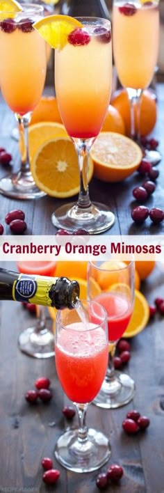 cranberry orange mimosas are garnished with cherries and served in wine glasses