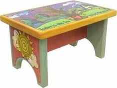 a small wooden bench with colorful designs on it