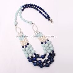 "Product Details : ITEM : AQUAMARINE, LAPIS LAZULI, PEARL BEADED NECKLACE Item Code : DGC2539 Gemstone Name : AQUAMARINE, LAPIS LAZULI, PEARL Chain Style : BEADED Beads Shape : Smooth Round/Rondelle Beads Size : 6mm/7mm/10mm/12 mm Approx Length : 24\"-26\" Inch Approx Weight : 530 Cts. Approx Customization : **Available** Please Feel Free To Contact If You Have Any Query." Blue Beaded Gems And Cabochons For Gift, Blue Natural Stones For Jewelry Making, Blue Gemstone Beads For Jewelry Making, Blue Gemstone Beads For Gifts, Blue Faceted Beads Gems And Cabochons For Gift, Blue Polished Beads For Jewelry Making, Blue Beaded Necklace With Natural Stones, Blue Faceted Beads For Gifts, Blue Gemstone Beaded Necklaces