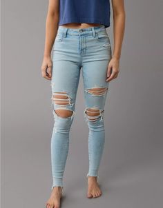 AE Next Level High-Waisted Ripped Jegging Everyday Stretch Distressed Jeans, Stretch Medium Wash Jeggings With Frayed Hem, Stretch Distressed Bottoms For Everyday, Everyday Stretch Distressed Bottoms, Distressed Stretch Bottoms For Everyday, Trendy High Rise Fitted Jeggings, Trendy Fitted High Rise Jeggings, Light Wash Mid-rise Fitted Jeggings, Fitted Mid-rise Light Wash Jeggings