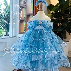 ♥ Introducing our enchanting blue dress adorned with delicate floral patterns, designed specifically for little girls who dream of embodying the elegance of their favorite princess, Elsa from Frozen. This exquisite dress features a captivating combination of blue, pink, and white hues, creating a magical appearance that is sure to delight any young girl. ♥ The sleeveless design is complemented by a unique style on the chest, while a large, eye-catching bow at the back adds a touch of charm and s Light Blue Tutu Dress For Summer Dress-up, Elegant Blue Princess Dress For Baptism, Whimsical Blue Dress For Dress-up, Light Blue Tulle Dress With Floral Applique, Blue Princess Dress For Holiday Party, Blue Princess Dress With Tulle Skirt For Wedding, Blue Pageant Dress For Spring, Blue Spring Pageant Dress, Blue Spring Pageant Dress For Party