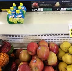 apples, pears, and other fruit are on display in a grocery store's produce section