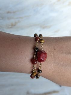 Unleash the power of nature with our stunning red jasper and tiger's eye bracelet, intricately crafted with a handmade chain. Red jasper is known for its grounding properties, promoting stability and endurance, while tiger's eye enhances courage and strength. Each bracelet is a one-of-a-kind creation, brimming with the potent energy of these remarkable stones. Embrace the unique power of this bracelet and embark on your journey with confidence and resilience. https://www.etsy.com/listing/1718274 Handmade Jasper Bracelets As Gifts, Handmade Red Chain Bracelet As Gift, Handmade Red Chain Bracelet For Gift, Handmade Red Chain Bracelet Gift, Adjustable Jasper Bracelet Gift, Jasper Beaded Bracelets With Natural Stones As Gift, Handmade Jasper Beaded Bracelets Gift, Red Natural Stones Bracelets For Gift, Adjustable Spiritual Garnet Jewelry