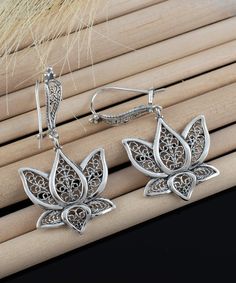 Introducing our exquisite artisan made, handcrafted filigree art 925 sterling silver dangle drop earrings inspired by the lotus flower, designed by our master artisan in our workshop. These earrings are perfect for your daily style, match your elegance and attract all eyes on you with their exquisitely intricate ornaments. These lightweight earrings also make a perfect gift for your loved one for any occasion like anniversary, birthday, or thanksgiving. The lotus flower serves as a symbol of pur Thoughtful Gifts For Her, Sterling Silver Filigree, Lightweight Earrings, Daily Style, Silver Filigree, Light Weight Earrings, Sterling Silver Charm, Lotus Flower, Flower Earrings