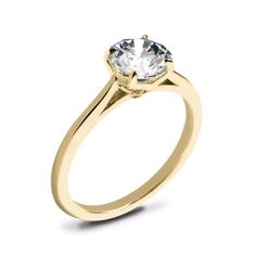 a yellow gold engagement ring with a round diamond in the center, on a white background