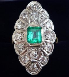 Date made: 1910's Diamond content: 0.98ct Emerald content: 0.65ct Metal: 18ct gold and white gold Finger length: 27mm Width: 16mm Condition: Excellent commensurate to it's age Ring Size: UK/AUS O   US/CAN 7  can be resized This stunning antique ring originates from around 1910. It showcases fourteen beautiful 0.07ct european old cut diamonds set in 18ct white gold totaling 0.98ct. These are SI clarity G-H colour and together make a fabulous flash. At the focal point is a wonderful 0.65ct colombi Antique Rings Vintage, Antique Jewellery Online, Engagement Ring Photos, Marquise Ring, Vs2 Diamond, Antique Ring, Colombian Emeralds, Antique Engagement, Diamond Solitaire Engagement Ring