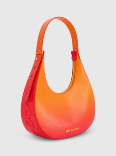 Add a pop of color to any look with our bold Ombre Leather Hobo Bag. Its trendy ombre design and convenient size seamlessly blends fashion and functionality, making it the perfect accessory for any occasion. Mac Duggal Leather Construction 24k Gold-plated hardware Two interior pockets Zipper closure Chic top handle with 9"in adjustable shoulder strap Medium size: W 11.8 in x H 11.0 in x D 3.5 in (metric: 30cm X 28cm X 9cm) Fits up to: iPhone 14, Airpods, Wallet, and Lipstick Available in Sunset Orange Shoulder Bag, Ombre Bag, Orange Bags, Sunset Ombre, Orange Handbag, Trendy Bags, Ombre Design, Ombre Fashion, Hobo Shoulder Bag